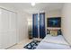 Cozy bedroom featuring beach-themed decor, a single bed, and ample closet space at 121 Ellicott Dr, Ormond Beach, FL 32176
