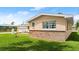 Well-kept home featuring a brick foundation, lush lawn, and an attached garage, blending curb appeal at 121 Ellicott Dr, Ormond Beach, FL 32176