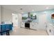 Bright kitchen with white cabinets, modern appliances, and a functional layout for cooking and dining at 121 Ellicott Dr, Ormond Beach, FL 32176