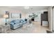 Open-concept living room with modern decor flowing into a bright and airy kitchen at 121 Ellicott Dr, Ormond Beach, FL 32176