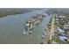 Aerial view showcasing the waterfront property with private dock and canal access at 1212 Commodore Dr, New Smyrna Beach, FL 32168