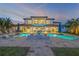 Stunning backyard pool and spa with fire bowls and spacious deck, perfect for outdoor entertaining at 1212 Commodore Dr, New Smyrna Beach, FL 32168