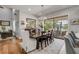 Spacious dining room with ample natural light, perfect for Gathering gatherings and enjoying views of the outdoor scenery at 1212 Commodore Dr, New Smyrna Beach, FL 32168