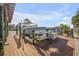 A private dock with boat lifts offers waterfront access and convenient boat storage; a boater's dream! at 1212 Commodore Dr, New Smyrna Beach, FL 32168