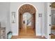 Charming entryway with hardwood floors, a brick archway, and stylish decor at 1212 Commodore Dr, New Smyrna Beach, FL 32168