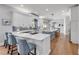 Stylish kitchen featuring white cabinetry, a center island, and modern appliances, creating a functional and inviting space at 1212 Commodore Dr, New Smyrna Beach, FL 32168