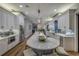 Modern kitchen featuring white cabinets, marble countertops and a large island with bar stool seating at 1212 Commodore Dr, New Smyrna Beach, FL 32168