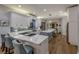 Modern kitchen with stainless steel appliances, quartz countertops, and stylish island seating, designed for culinary enthusiasts at 1212 Commodore Dr, New Smyrna Beach, FL 32168