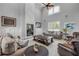 Bright living room with high ceilings, modern fireplace, and comfortable seating, perfect for entertaining at 1212 Commodore Dr, New Smyrna Beach, FL 32168