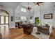 Elegant living room with hardwood floors, high ceilings, and stylish decor, creating a warm and inviting space at 1212 Commodore Dr, New Smyrna Beach, FL 32168