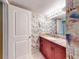 Charming bathroom featuring fish-themed wallpaper, granite vanity top, and recessed lighting at 133 Cedar Dunes Dr, New Smyrna Beach, FL 32169