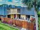 Townhouse with wooden fence, back patio and balcony at 133 Cedar Dunes Dr, New Smyrna Beach, FL 32169