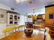 Inviting kitchen/dining area with stylish fan, warm wood tones, and ample natural light creates a welcoming space at 133 Cedar Dunes Dr, New Smyrna Beach, FL 32169
