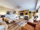 Cozy living room with fireplace, comfortable seating, and stylish decor, creating an inviting atmosphere at 133 Cedar Dunes Dr, New Smyrna Beach, FL 32169