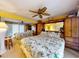 The main bedroom features a ceiling fan, built in storage, and mirrored closet doors at 133 Cedar Dunes Dr, New Smyrna Beach, FL 32169