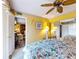Bright main bedroom with large bed, ceiling fan, and access to a private balcony at 133 Cedar Dunes Dr, New Smyrna Beach, FL 32169
