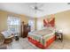 Bedroom with neutral walls, large windows, ceiling fan and tiled flooring at 1363 Wayne Ave, New Smyrna Beach, FL 32168