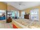 Bright bedroom featuring a ceiling fan, a flat-screen TV, and access to the patio at 1363 Wayne Ave, New Smyrna Beach, FL 32168