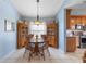 Dining room with traditional furnishings, a chandelier and views of the kitchen area at 1363 Wayne Ave, New Smyrna Beach, FL 32168