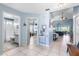 Light-filled foyer with tile flooring offering views of the living spaces and bathroom at 1363 Wayne Ave, New Smyrna Beach, FL 32168