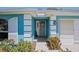Welcoming front entrance featuring lush landscaping and charming architectural details at 1363 Wayne Ave, New Smyrna Beach, FL 32168