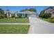 Beautiful single-story home with well-manicured lawn and inviting curb appeal at 1363 Wayne Ave, New Smyrna Beach, FL 32168