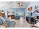 Bright living room featuring tile flooring, vaulted ceilings, coastal decor and sliders leading to the lanai at 1363 Wayne Ave, New Smyrna Beach, FL 32168