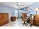 Home office with a ceiling fan, built-in shelving, and a computer desk at 1363 Wayne Ave, New Smyrna Beach, FL 32168