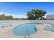 Inviting pool surrounded by lounge chairs, set against a backdrop of lush greenery at 1363 Wayne Ave, New Smyrna Beach, FL 32168