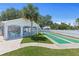 Community shuffleboard court with a poolside cabana, perfect for outdoor entertainment at 1363 Wayne Ave, New Smyrna Beach, FL 32168