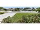 Charming street view featuring well-maintained homes and landscaped front yards under a bright, sunny sky at 1363 Wayne Ave, New Smyrna Beach, FL 32168