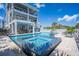 Stunning backyard with pool, spa, and patio areas perfect for outdoor entertaining at 1373 N Atlantic Ave, New Smyrna Beach, FL 32169