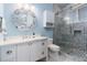 Modern bathroom with beautiful vanity and a glass door shower with mosaic tile at 1373 N Atlantic Ave, New Smyrna Beach, FL 32169