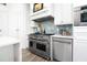 Stainless steel appliances and range hood over a professional grade kitchen range at 1373 N Atlantic Ave, New Smyrna Beach, FL 32169