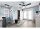Bright laundry room with modern washer and dryer, ample natural light, and adjacent half-bath for added convenience at 1373 N Atlantic Ave, New Smyrna Beach, FL 32169