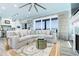 Bright open living space with a view, comfortable sofa, fireplace, and modern decor at 1373 N Atlantic Ave, New Smyrna Beach, FL 32169