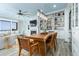 Bright open living space with a fireplace, large bookshelf and wooden table at 1373 N Atlantic Ave, New Smyrna Beach, FL 32169