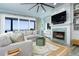 Open living space with a view, comfortable sofa, fireplace, and modern decor at 1373 N Atlantic Ave, New Smyrna Beach, FL 32169