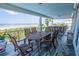 Inviting outdoor dining space with ocean views, complete with a large table and comfortable seating for entertaining at 1373 N Atlantic Ave, New Smyrna Beach, FL 32169