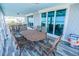 Picturesque outdoor dining area with ocean views and seamless indoor-outdoor flow through sliding glass doors at 1373 N Atlantic Ave, New Smyrna Beach, FL 32169