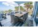 Elegant outdoor dining space with ocean views and seating for ten, perfect for al fresco dining and entertaining at 1373 N Atlantic Ave, New Smyrna Beach, FL 32169