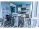Outdoor kitchen with granite countertops, stainless steel appliances, and bar seating with ocean views at 1373 N Atlantic Ave, New Smyrna Beach, FL 32169