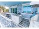 Beautiful outdoor kitchen featuring granite countertops, stainless steel grill, and ocean views at 1373 N Atlantic Ave, New Smyrna Beach, FL 32169
