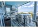 Well-appointed outdoor kitchen and island overlooking the ocean, ideal for cooking and entertaining in style at 1373 N Atlantic Ave, New Smyrna Beach, FL 32169