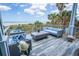 Serene outdoor seating area with ocean views, featuring comfortable seating and a stylish fire pit table at 1373 N Atlantic Ave, New Smyrna Beach, FL 32169