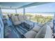Expansive outdoor seating area with ocean views, perfect for gatherings and enjoying the coastal scenery at 1373 N Atlantic Ave, New Smyrna Beach, FL 32169