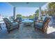 Relaxing patio with comfortable seating overlooking the sparkling pool at 1373 N Atlantic Ave, New Smyrna Beach, FL 32169