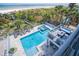 Beautiful pool and deck featuring lounge chairs, an outdoor seating area, and ocean views at 1373 N Atlantic Ave, New Smyrna Beach, FL 32169