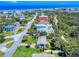 An aerial view of the home, neighborhood, and distant ocean at 16 Hillside Dr, New Smyrna Beach, FL 32169