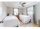 Bright and airy bedroom with two twin beds and charming nautical decor at 16 Hillside Dr, New Smyrna Beach, FL 32169